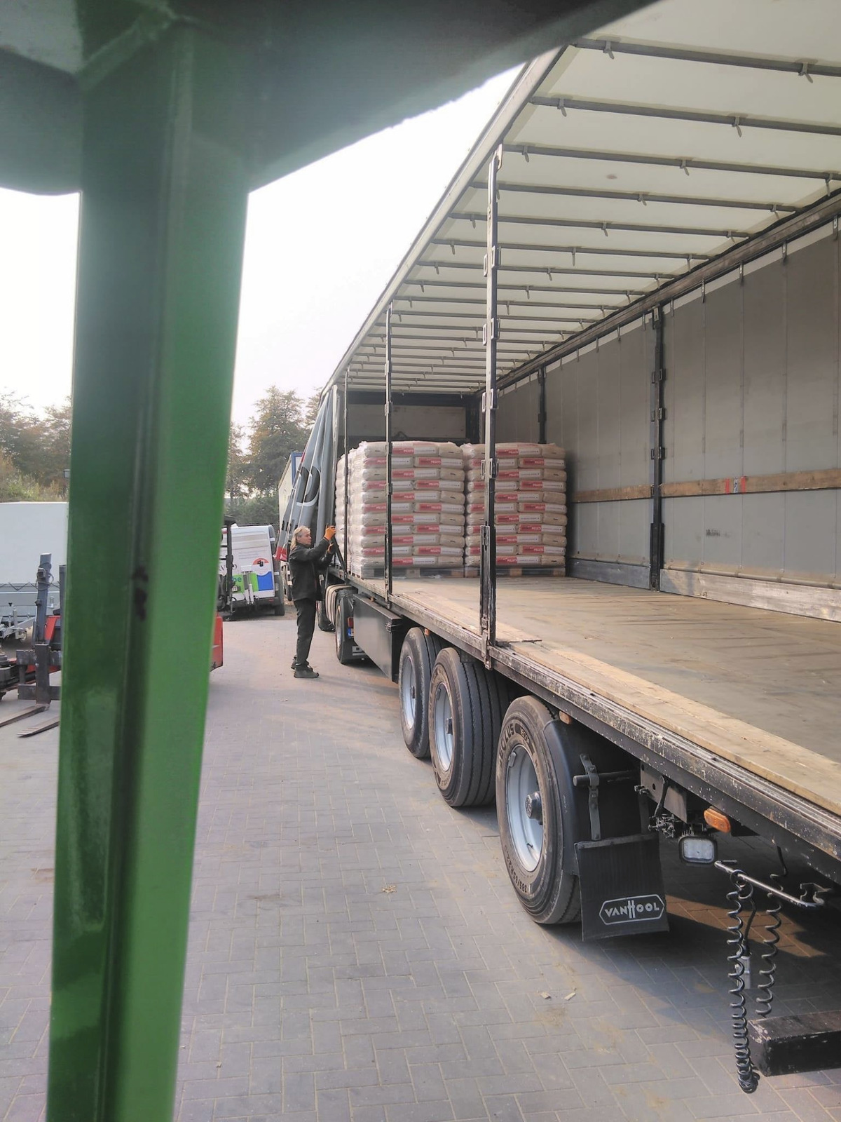 Wood pellet pallets being loaded for delivery